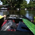 POSITIONING BOAT TO RESCUE FLOODED ELDERLY NEIGHBOR